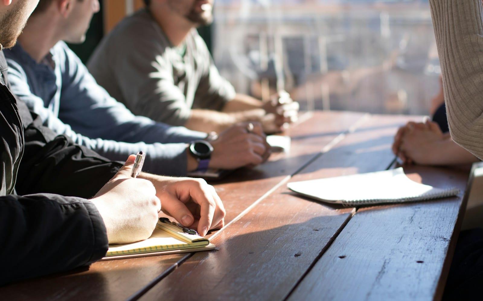 A working discussion over a laptop, of the kind that starts every Hash engagement